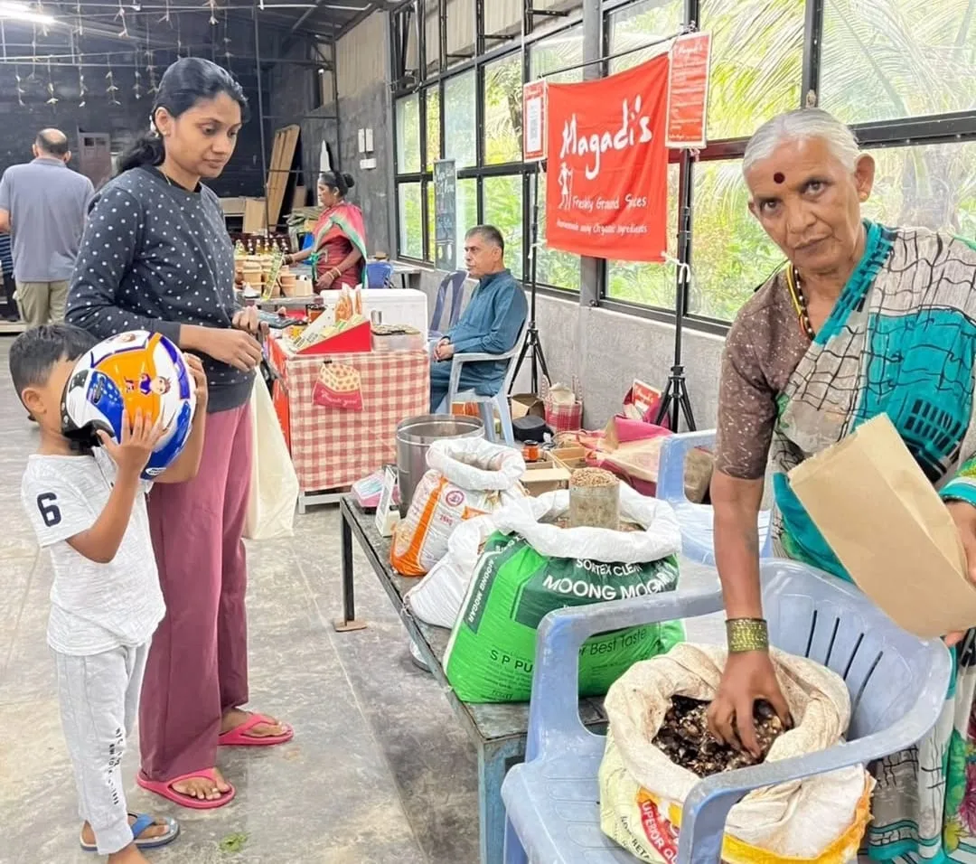 Shoppers at a produce stall at the Ragi Kana Sunday santhe