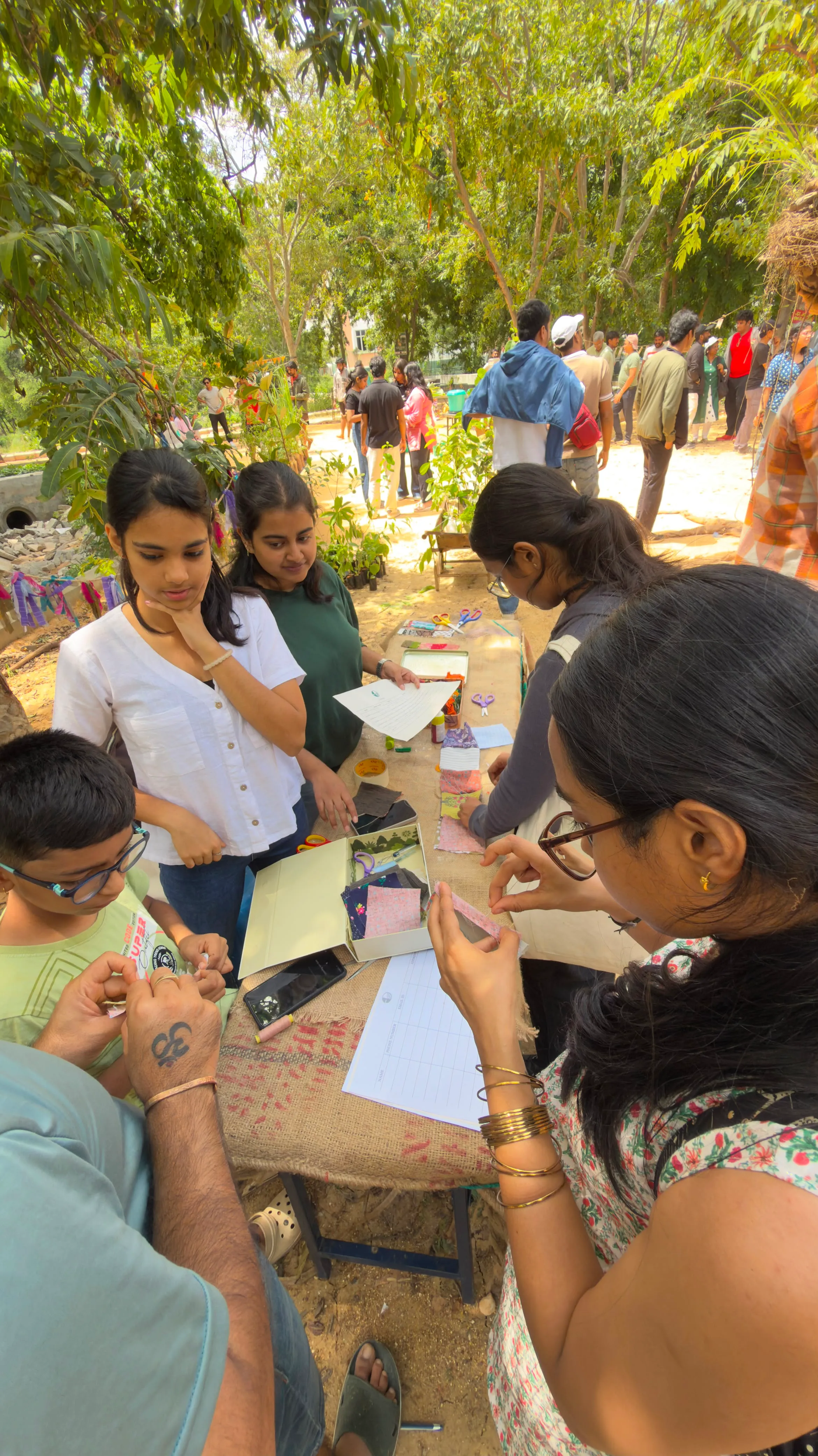 Volunteers and children working together at an awareness drive