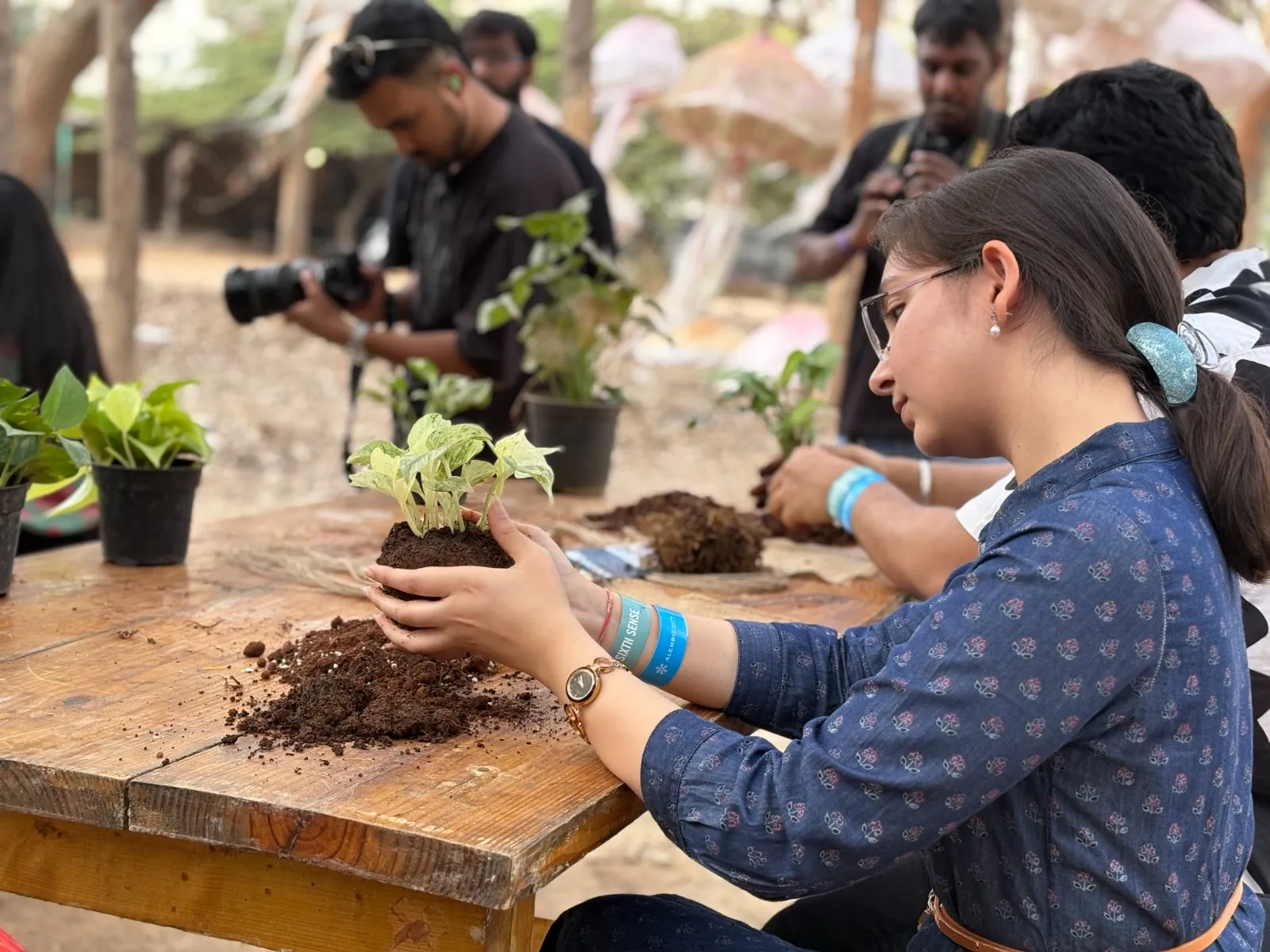 Volunteers potting saplings at a workshop